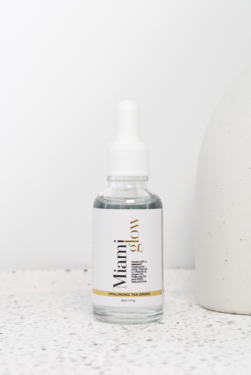 Hyaluronic Tanning Drops bottle, Tanning drops with hyaluronic acid, Anti-aging tanning drops, miami glow